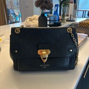 Louis Vuitton Elegant Black Shoulder Bag with Gold Accents